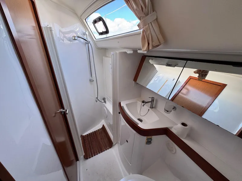 Slide: The Image of Luxurious bathroom in 2012 Beneteau 40 yacht with shower, sink, and mirror. - 4