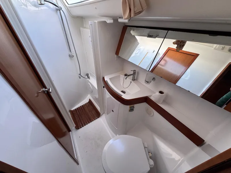 Slide: The Image of Modern bathroom in a 2012 Beneteau 40 yacht with shower and sink. - 41