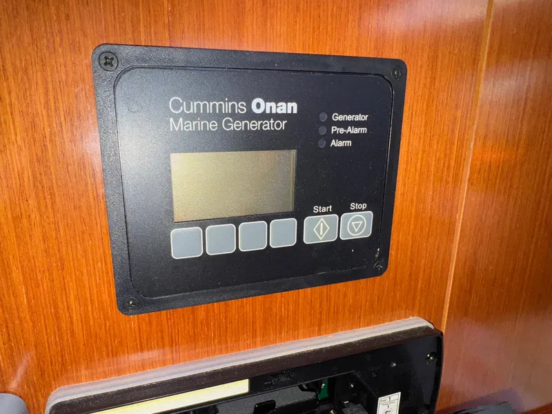 Slide: The Image of Cummins Onan marine generator control panel on 2012 Beneteau 40 yacht. - 42