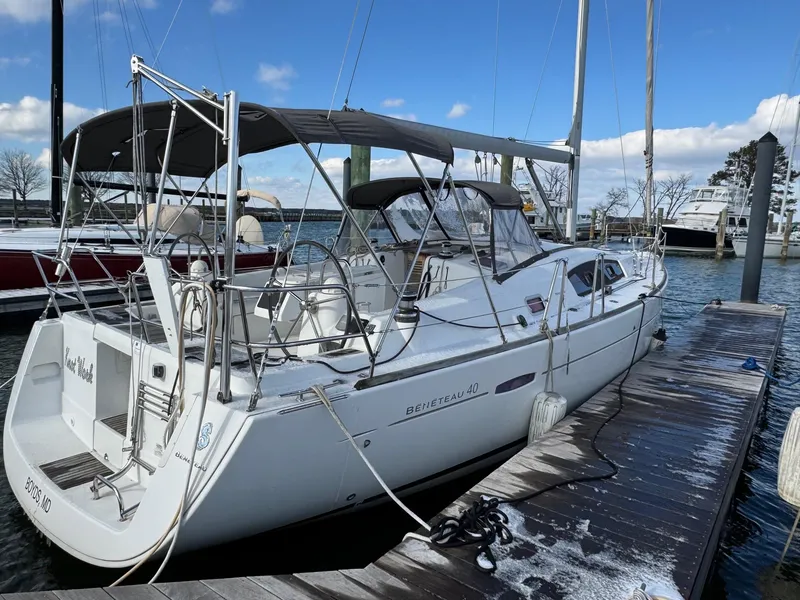 Slide: The Image of Sailboat docked at marina, 2012 Beneteau 40 model, under clear blue sky. - 8