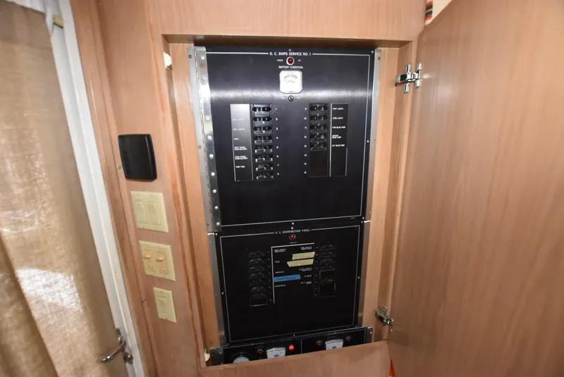 Slide: The Image of Interior of 1996 Hatteras 50 Convertible yacht with seating, table, and kitchenette. - 14