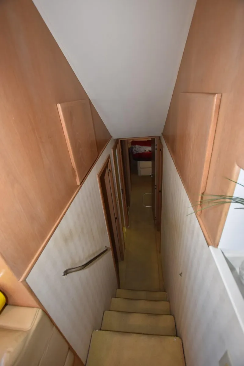 Slide: The Image of Bathroom interior of 1996 Hatteras 50 Convertible yacht, featuring shower and toilet. - 19