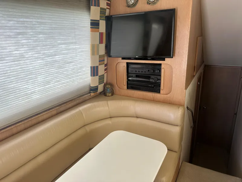 Slide: The Image of Kitchen area of a 1996 Hatteras 50 Convertible yacht with microwave and cooktop. - 23