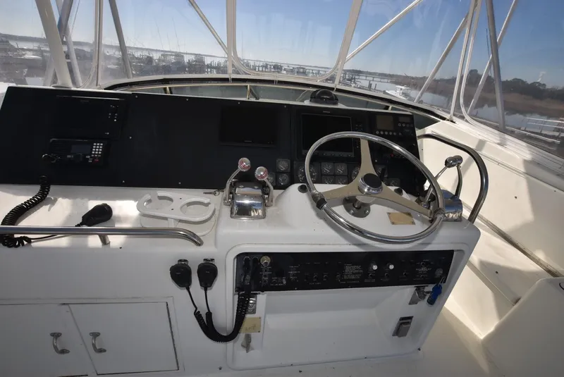 Slide: The Image of 1996 Hatteras 50 Convertible yacht helm with navigation equipment and controls. - 31