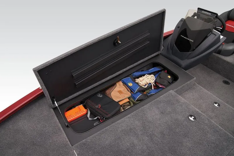 Slide: The Image of Storage compartment in 2025 Tracker Savage 215 boat, organized with gear and accessories. - 12
