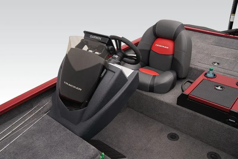 Slide: The Image of 2025 Tracker Savage 215 boat interior with Garmin system and comfortable seating. - 18