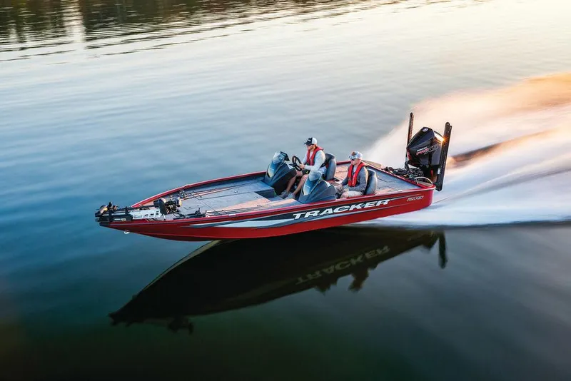 Slide: The Image of 2025 Tracker Savage 215 boat speeding on calm water. - 33