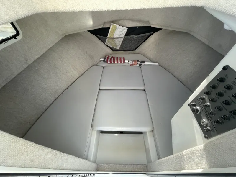 Slide: The Image of 2020 Parker 2520 XLD Sport Cabin interior with cushioned seating and control panel. - 12