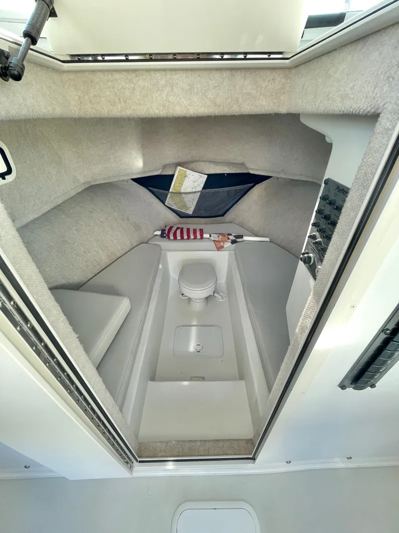 Slide: The Image of 2020 Parker 2520 XLD Sport Cabin interior with compact toilet and cozy seating. - 13