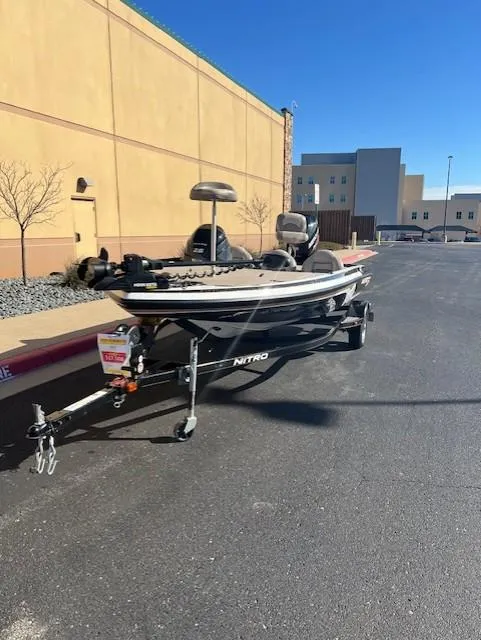 Slide: The Image of 2013 Nitro Z6 boat on trailer in urban setting, sunny day. - 3