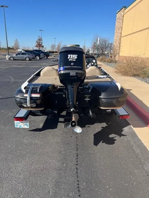 Slide: The Image of 2013 Nitro Z6 boat with 115 HP engine in parking lot. - 4