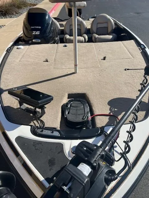 Slide: The Image of 2013 Nitro Z6 boat deck with motor and fishing equipment. - 5