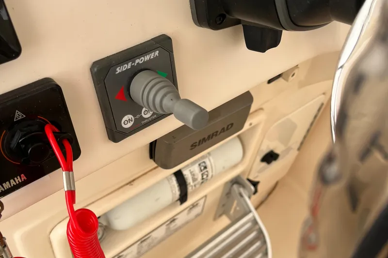 Slide: The Image of Control panel of a 2012 Grady-White Express 305 boat with Side-Power joystick. - 11