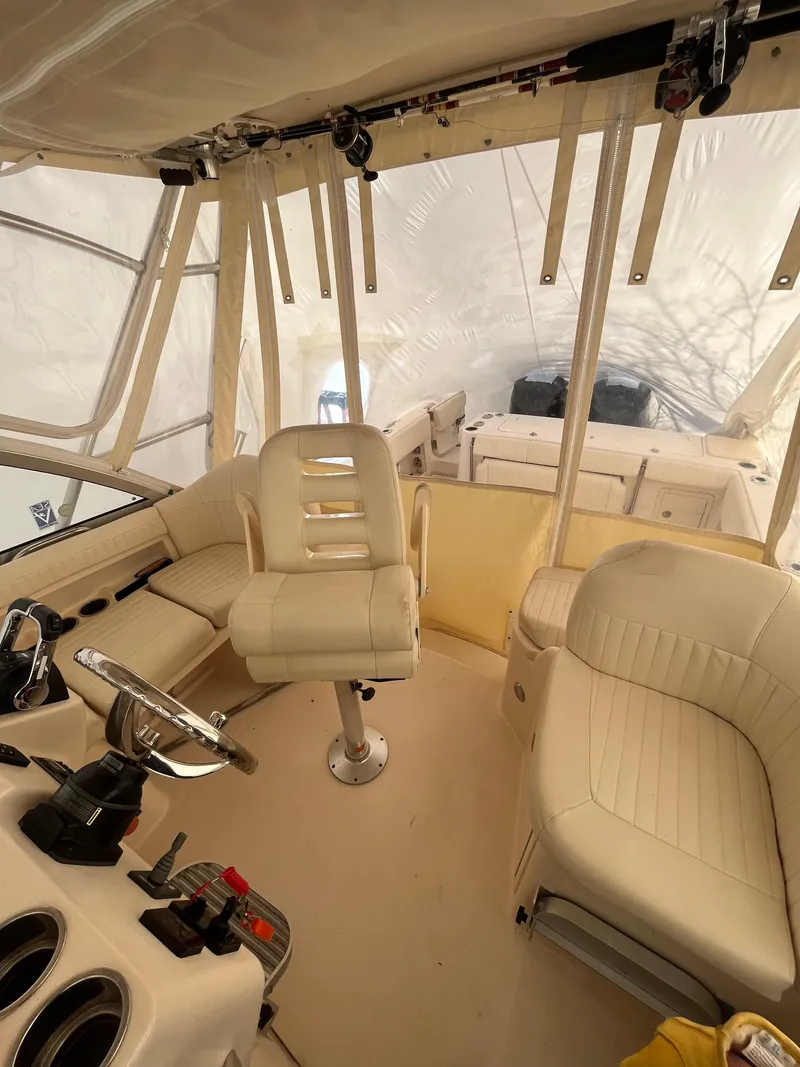 Slide: The Image of 2012 Grady-White Express 305 boat interior with helm, seating, and controls. - 13