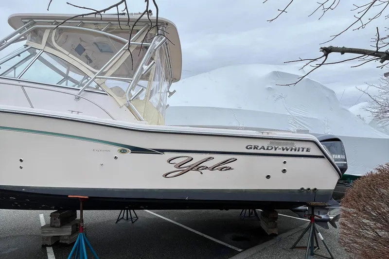 Slide: The Image of 2012 Grady-White Express 305 boat on stands, side view, outdoors. - 4