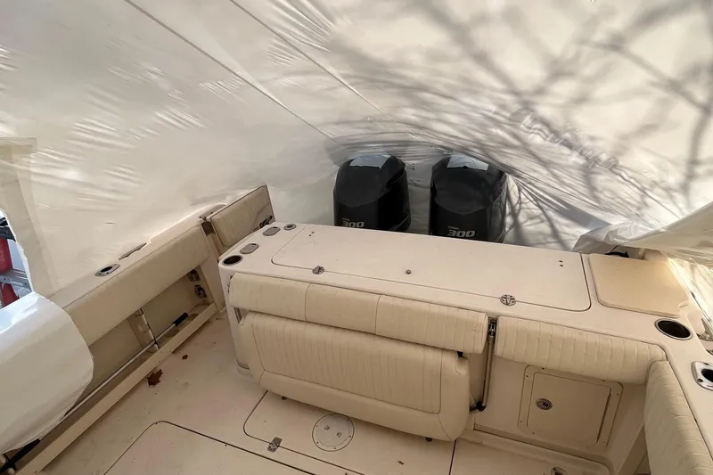 Slide: The Image of 2012 Grady-White Express 305 boat interior with twin 300 horsepower engines. - 6