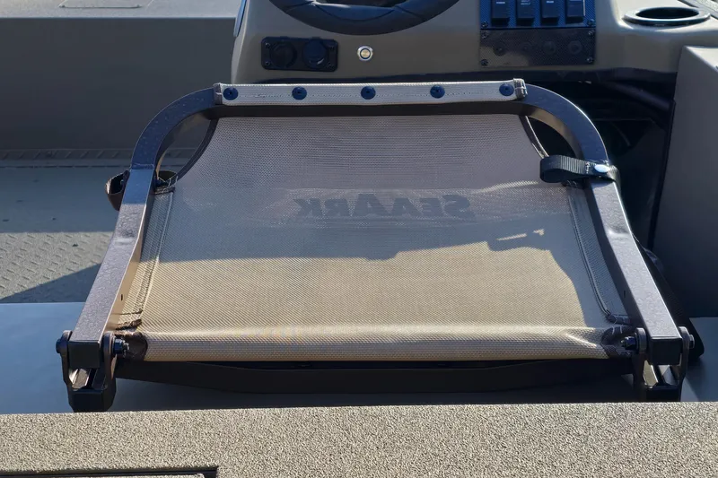 Slide: The Image of 2025 SeaArk Shadow 18 boat interior with dual seats and steering wheel. - 4