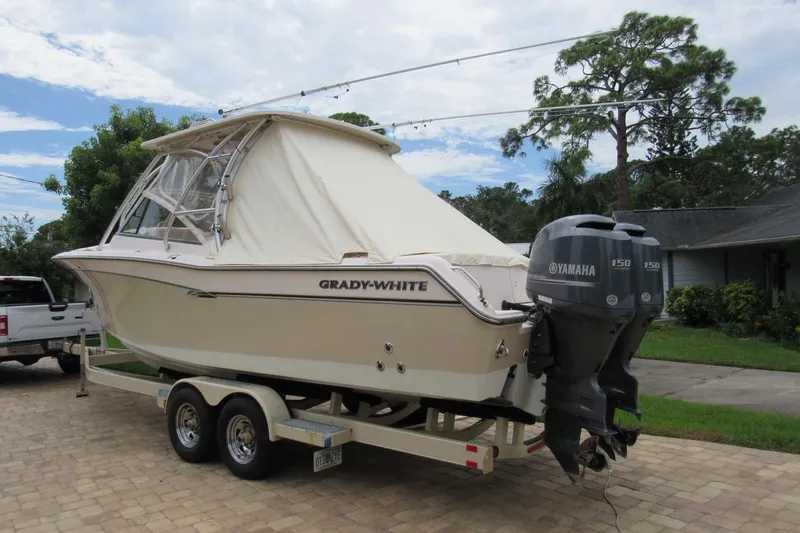 Slide: The Image of 2013 Grady-White Freedom 275 boat on trailer with Yamaha outboard motor. - 33