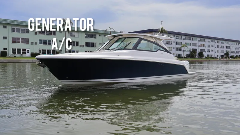Slide: The Image of 2022 Tiara Yachts 34 LX boat on water, featuring generator and air conditioning. - 0