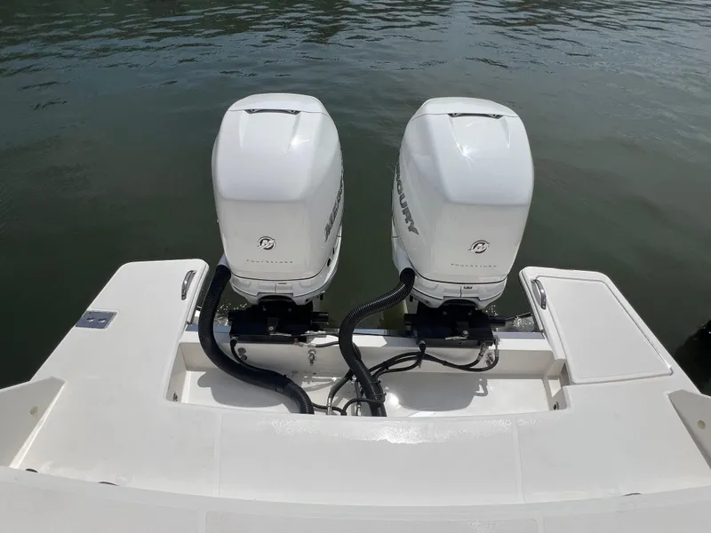 Slide: The Image of 2022 Tiara Yachts 34 LX with dual outboard engines on water. - 11