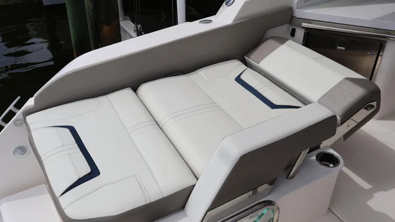 Slide: The Image of Luxury seating on 2022 Tiara Yachts 34 LX, featuring elegant white upholstery. - 17