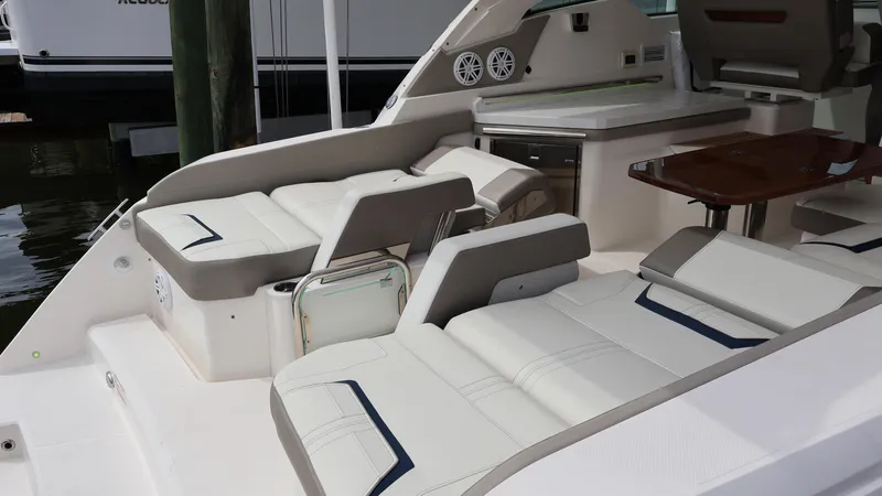 Slide: The Image of 2022 Tiara Yachts 34 LX interior with luxurious seating and sleek design. - 18