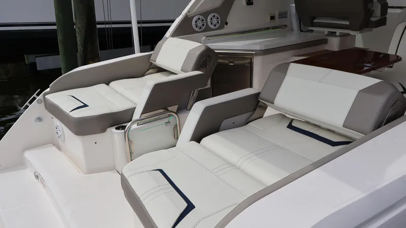 Slide: The Image of 2022 Tiara Yachts 34 LX interior with luxurious seating and modern design. - 19