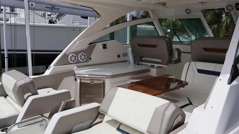 Slide: The Image of 2022 Tiara Yachts 34 LX interior with luxurious seating and modern amenities. - 20