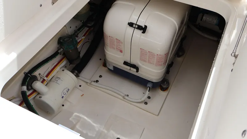 Slide: The Image of 2022 Tiara Yachts 34 LX engine compartment with equipment and wiring. - 23