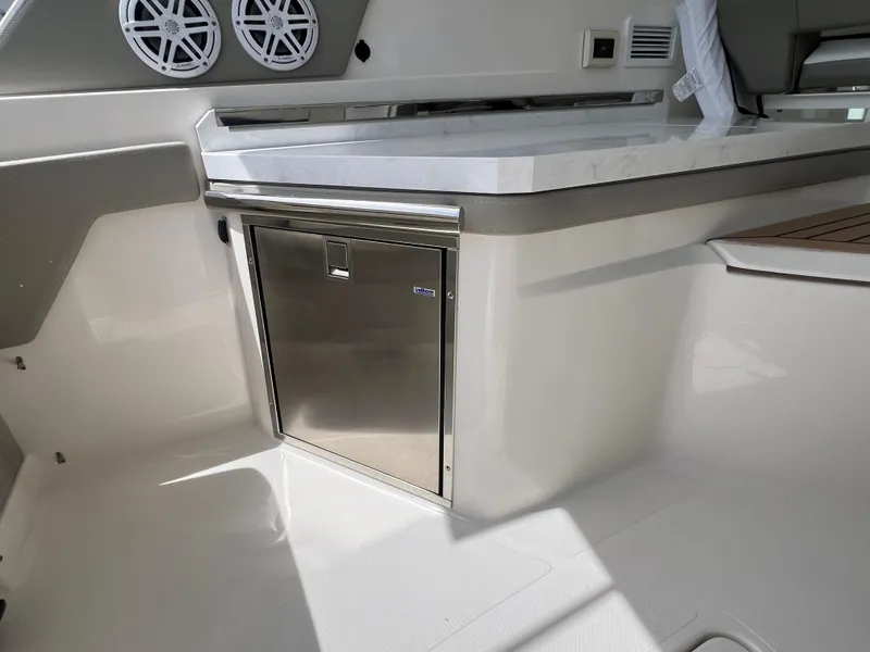 Slide: The Image of Interior of 2022 Tiara Yachts 34 LX, featuring sleek cabinetry and modern design elements. - 26