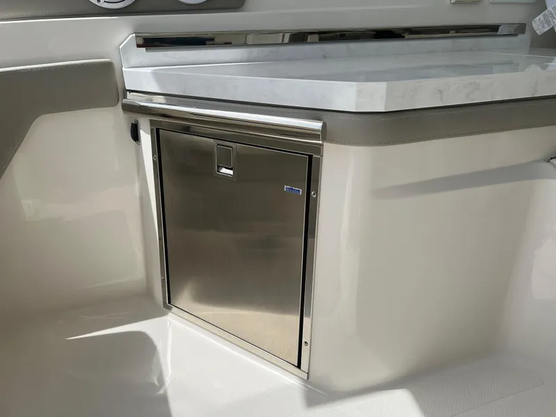 Slide: The Image of 2022 Tiara Yachts 34 LX interior with stainless steel cabinet and countertop. - 27