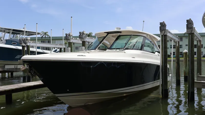 Slide: The Image of 2022 Tiara Yachts 34 LX docked, showcasing sleek design and modern features. - 3