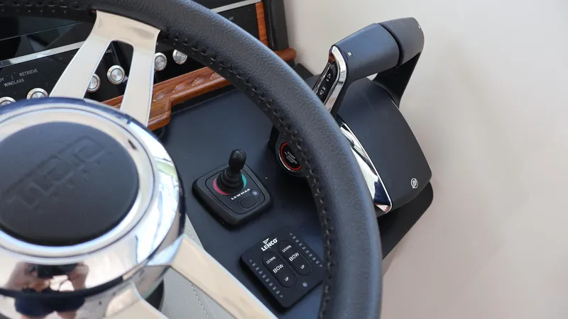 Slide: The Image of Steering wheel and controls of 2022 Tiara Yachts 34 LX boat. - 38