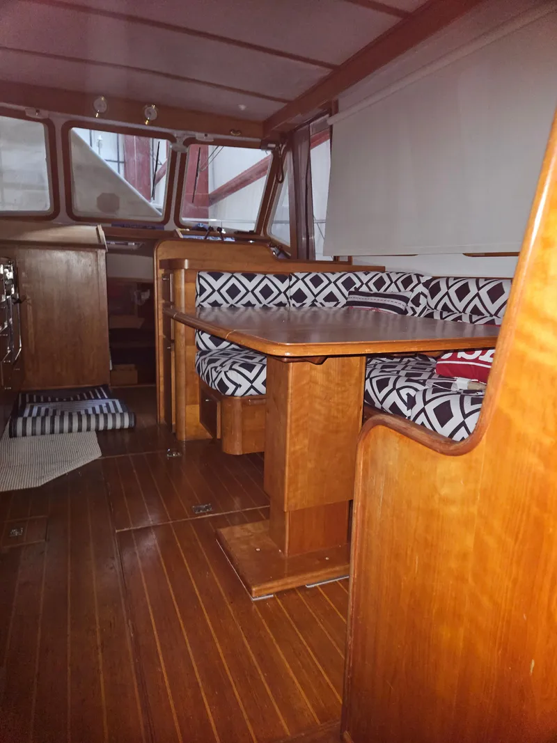 Slide: The Image of 1998 Sabre 36 Fast Trawler interior with wooden finish and patterned seating. - 12