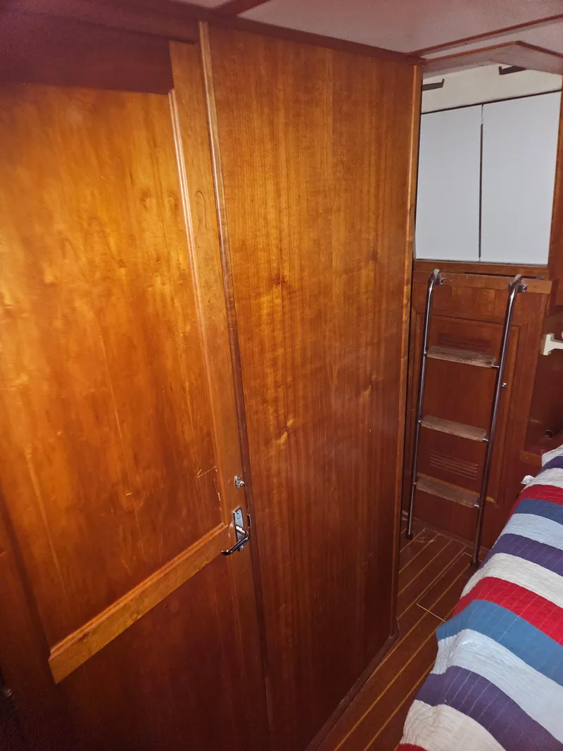 Slide: The Image of Interior of 1998 Sabre 36 Fast Trawler with wooden cabinetry and ladder. - 15