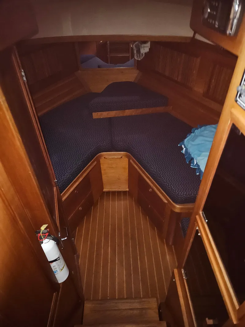 Slide: The Image of 1998 Sabre 36 Fast Trawler cabin with wooden interior and V-berth. - 16