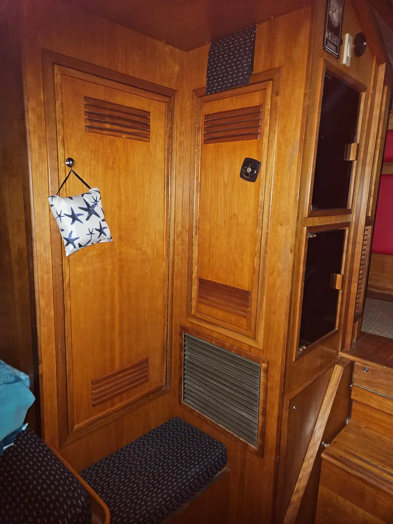 Slide: The Image of Interior of 1998 Sabre 36 Fast Trawler with wooden cabinetry and seating. - 17