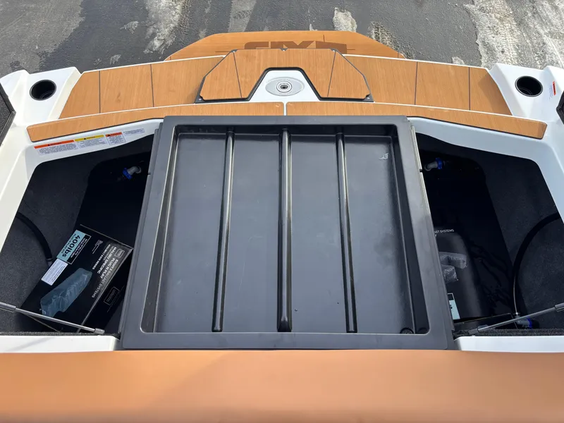 Slide: The Image of 2025 Axis T220 boat storage compartment with sleek design and modern features. - 12