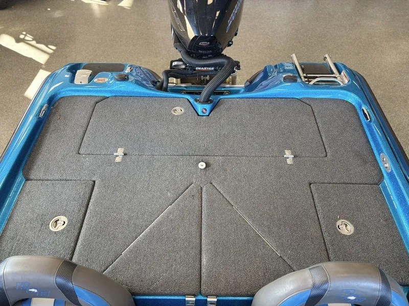 Slide: The Image of 2020 Bass Cat Puma FTD boat deck with storage compartments and motor. - 10