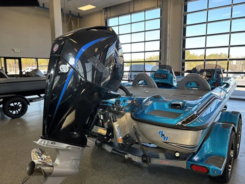 Slide: The Image of 2020 Bass Cat Puma FTD boat with powerful outboard motor in showroom. - 13