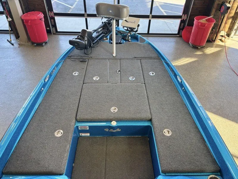 Slide: The Image of 2020 Bass Cat Puma FTD boat interior with storage compartments and seating. - 8