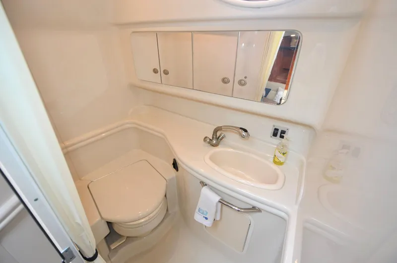 Slide: The Image of 2007 Sea Ray 340 Sundancer bathroom with sink, mirror, and toilet. - 10