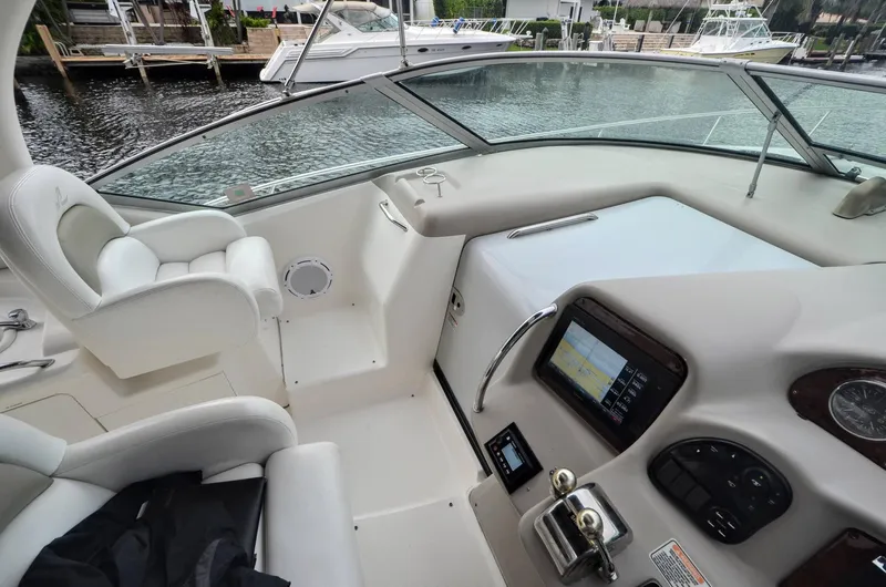 Slide: The Image of 2007 Sea Ray 340 Sundancer cockpit with modern controls and comfortable seating. - 12