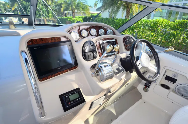 Slide: The Image of 2007 Sea Ray 340 Sundancer helm with modern controls and navigation system. - 15