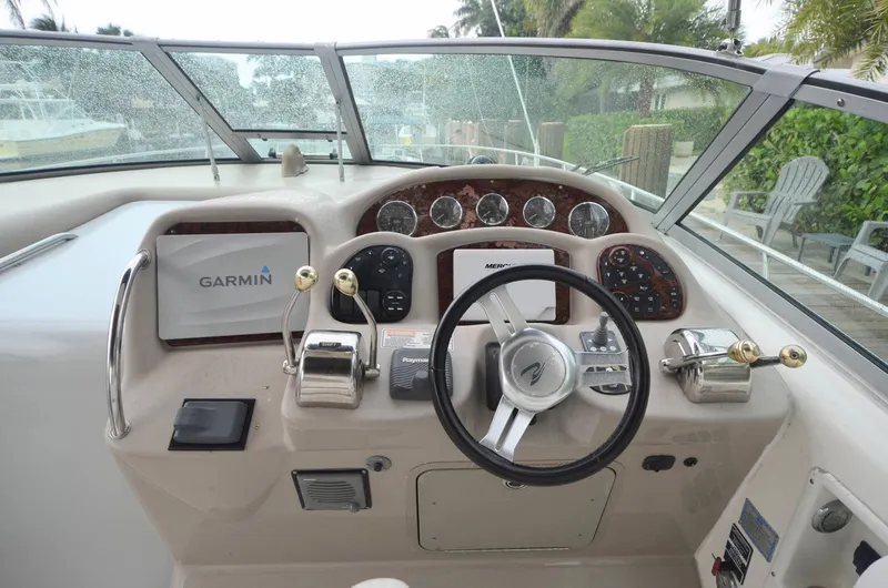 Slide: The Image of 2007 Sea Ray 340 Sundancer helm with Garmin navigation and classic instrument panel. - 16