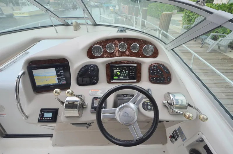Slide: The Image of Helm of 2007 Sea Ray 340 Sundancer with modern navigation instruments and controls. - 17