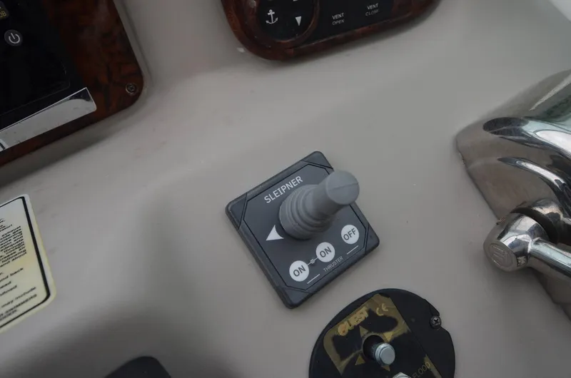 Slide: The Image of Control panel of a 2007 Sea Ray 340 Sundancer boat with joystick and switches. - 22