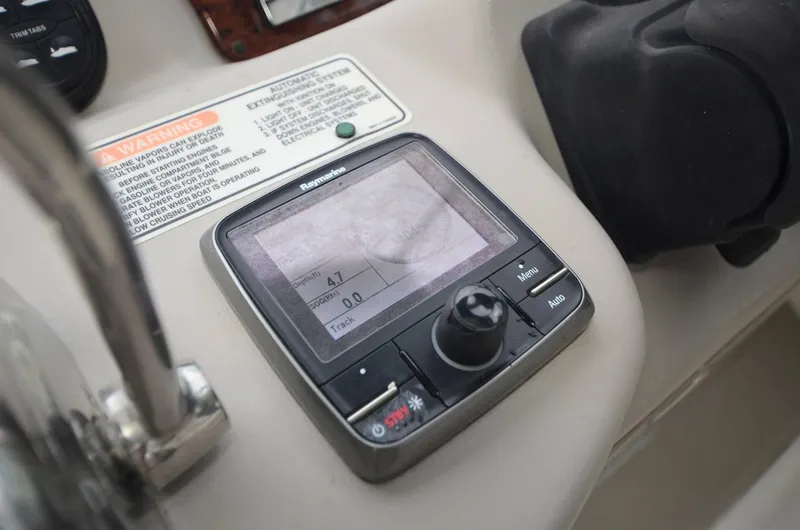 Slide: The Image of Control panel on 2007 Sea Ray 340 Sundancer boat dashboard with navigation display. - 23