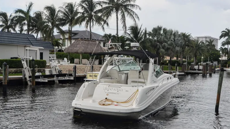 Slide: The Image of 2007 Sea Ray 340 Sundancer yacht cruising in a tropical marina with palm trees. - 31