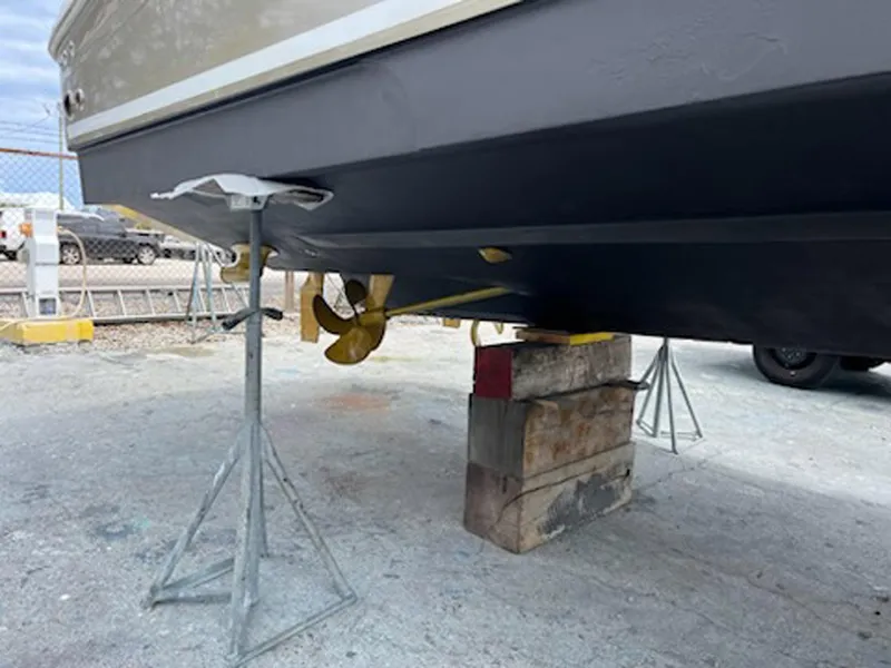 Slide: The Image of 2007 Sea Ray 340 Sundancer on stands, showing hull and propeller. - 38